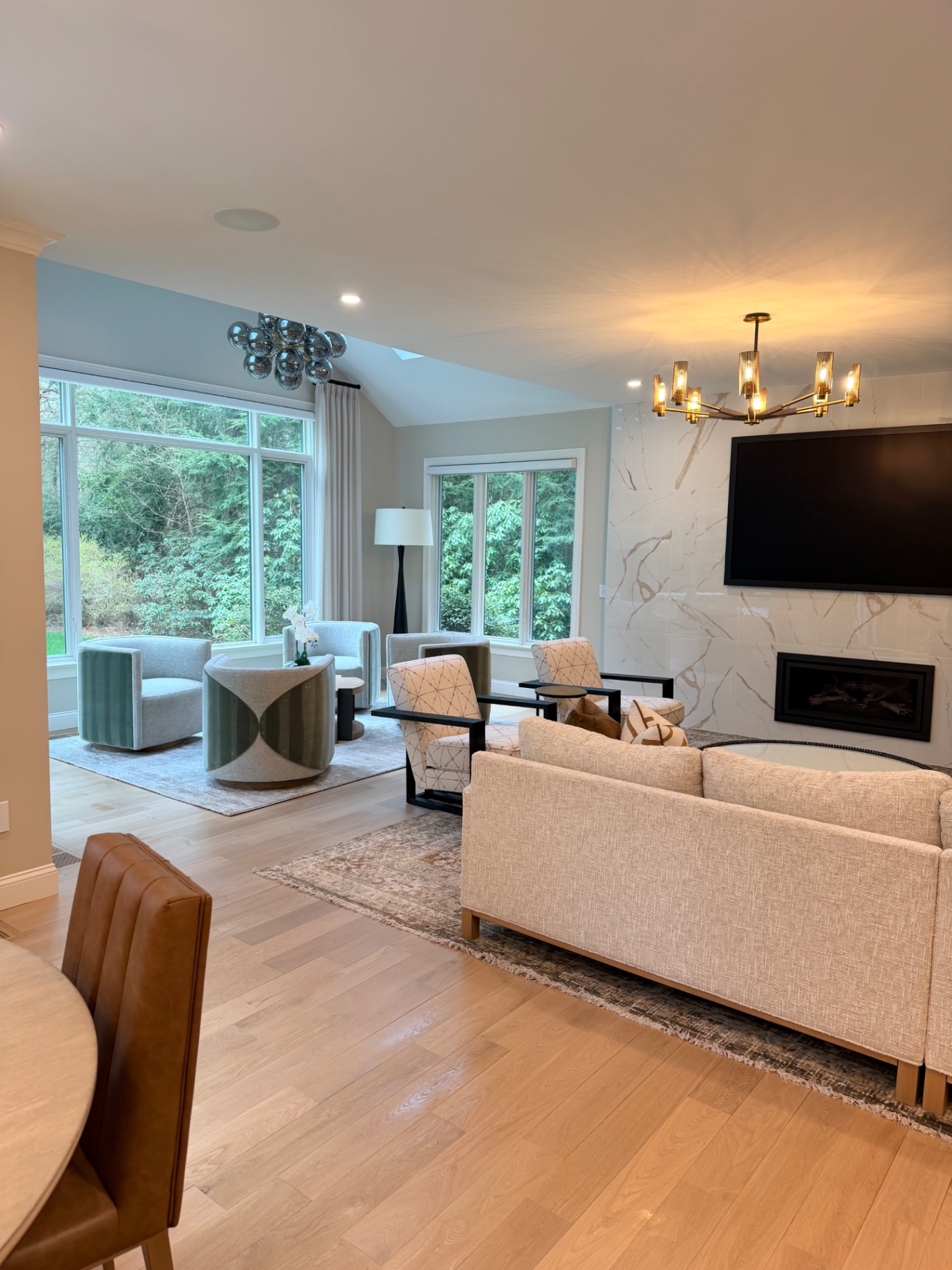 Bright living room with marble fireplace wall